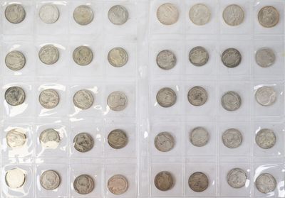 a lot of coins that are in a plastic case