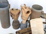 many old gas masks and other items on the table