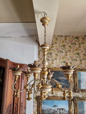 a chandelier hanging from the ceiling in a room