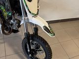 a dirt bike that is parked in a room