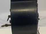 a statue of an angel on top of a black clock