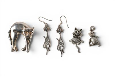 five different metal items that are on a white surface