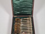 a wooden box with a set of silverware in it