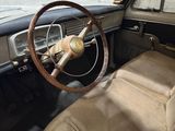 dashboard of an old car with a steering wheel and a steering wheel