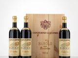 three bottles of wine in front of a wooden box
