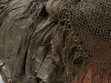a statue of a woman with a net on her head