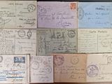 many different types of letters and stamps on the table