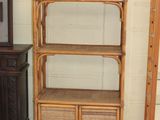 two shelves and a cabinet in the corner of a room