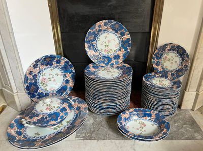 a lot of plates that are sitting on the floor
