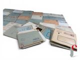 a pile of mail sitting on top of a table