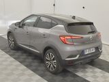 the back of a grey car is parked in a garage
