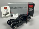an old model of a black car with a box and instructions