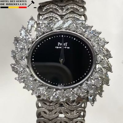 a close up of a wrist watch with diamonds on it