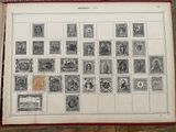 an old book with stamps on it sitting on a table