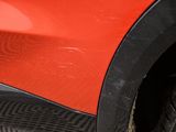 a close up of a red car with a black rim