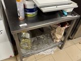 a counter with a cutting board on it in a kitchen