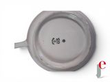 a close up of a plate on a white surface