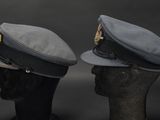 two hats that are sitting on top of a mannequin head