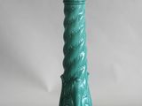 turquoise green candle holder on a white background with a white background
