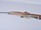 rifle on a white background with a wooden handle and a sling