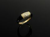 a gold ring with a black band and a white diamond