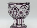 purple and white glass bowl with a design on the bottom