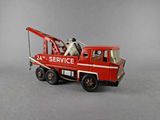 a red toy truck with a crane on top of it