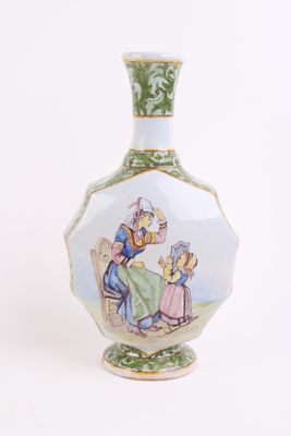 a vase with a picture of a man and a woman sitting at a table
