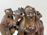 a statue of a man and a woman sitting on a bench