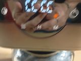 reflection of a person ' s hand in a coffee maker