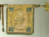 a gold and blue banner hanging on a wall