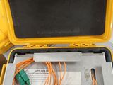 a yellow box with wires in it sitting on a table