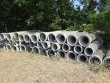 a pile of concrete pipes stacked on top of each other