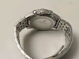 an image of a close up of a wrist watch on a table
