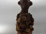 wooden figurine of a man with a hat and a hat on his head