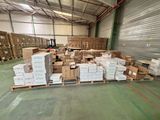 a large warehouse filled with lots of boxes and pallets
