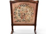 an image of a chair with a floral tapestry on the back