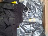 a box of clothing that is sitting on the floor