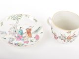a cup and saucer sitting next to each other on a table