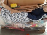 a pile of boxes sitting on top of a pallet