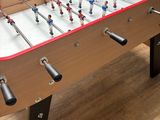 a foosball table in the corner of the room