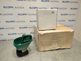 a box and a green bucket sitting on the floor