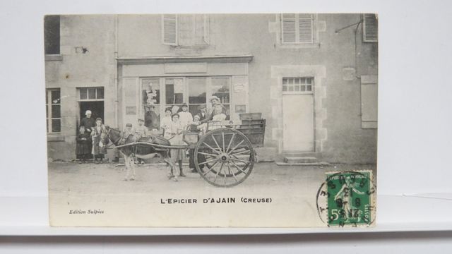 Ajain : L’Épicier. TBE. Carte rare !!!