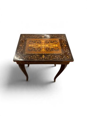 an image of a table with a design on the top of it