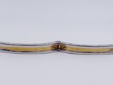 pair of silver and gold plated cuff bracelets on white background