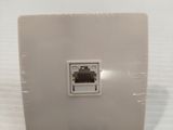 a white wall plate with a white ethernet plug on it