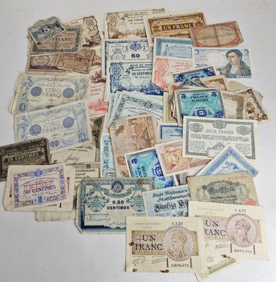 a pile of old money sitting on top of a table