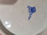 a blue and white plate with a bird on it