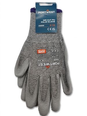 une paire de gants gris avec une étiquette bleue