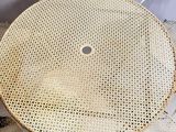 three chairs and a table with a round table top